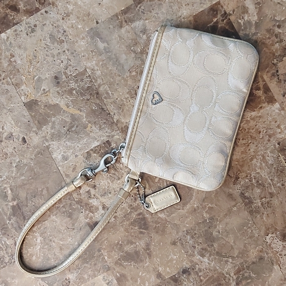 Coach Handbags - Gold Coach Poppy small wristlet, GUC